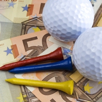 Golf balls and tees on Euros